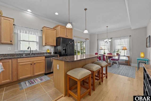 kitchen featuring a sink, dishwasher, a kitchen island, ornamental molding, and black fridge with ice dispenser