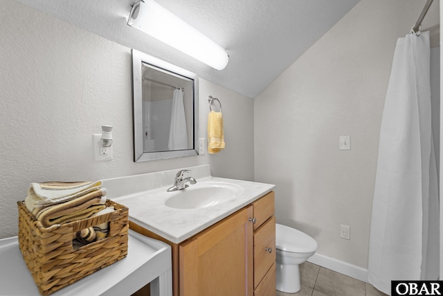 bathroom with tile patterned flooring, vanity, toilet, a textured ceiling, and lofted ceiling