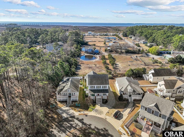 aerial view featuring a water view and a residential view