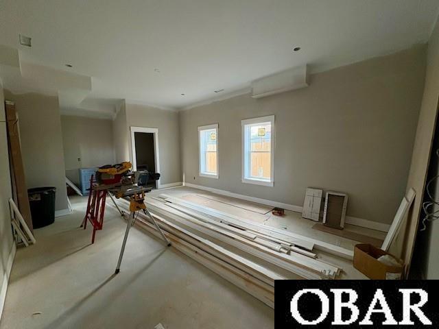 interior space featuring baseboards