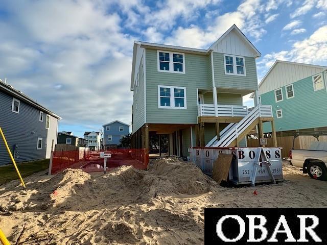 back of property with board and batten siding