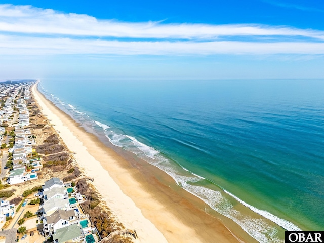 aerial view featuring a water view and a view of the beach