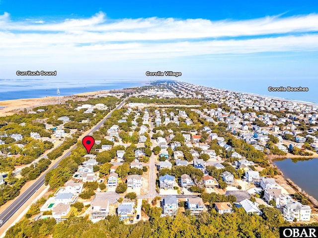 birds eye view of property featuring a residential view and a water view