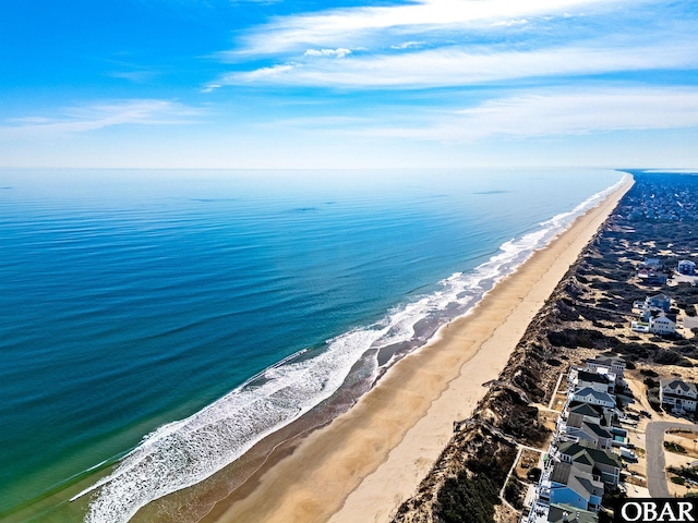 aerial view with a water view and a view of the beach