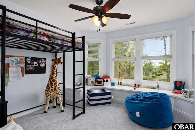 bedroom featuring visible vents, a ceiling fan, and carpet floors