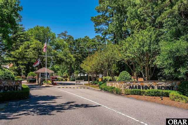 view of road with a gated entry