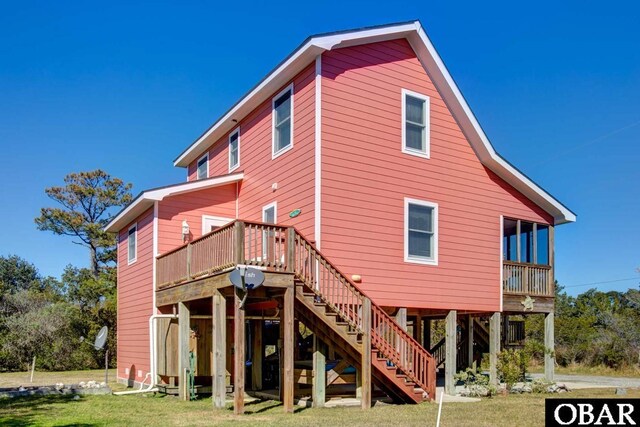 183 Lighthouse Rd Lot 3, Ocracoke, NC 27960 - rear view of property with stairway and a lawn
