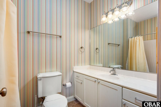 25238 Mac Oca Dr Lot 14, Waves, NC 27982 - bathroom featuring wallpapered walls, vanity, toilet, and tile patterned flooring