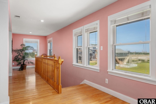 25238 Mac Oca Dr Lot 14, Waves, NC 27982 - hallway featuring an upstairs landing, light wood finished floors, plenty of natural light, baseboards, and recessed lighting
