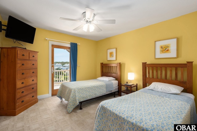 25238 Mac Oca Dr Lot 14, Waves, NC 27982 - bedroom featuring access to outside, light carpet, a ceiling fan, and baseboards