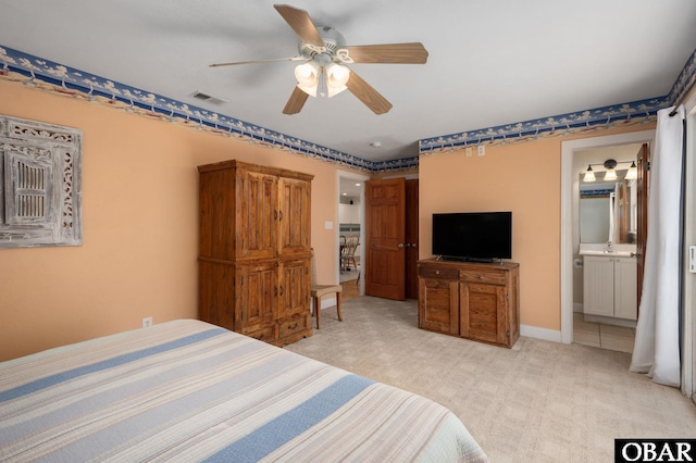 25238 Mac Oca Dr Lot 14, Waves, NC 27982 - bedroom featuring light colored carpet, baseboards, ceiling fan, and ensuite bathroom