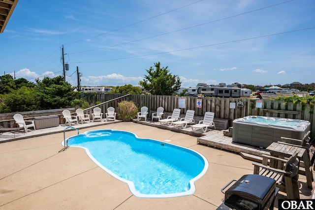 25238 Mac Oca Dr Lot 14, Waves, NC 27982 - view of swimming pool featuring a patio and a hot tub