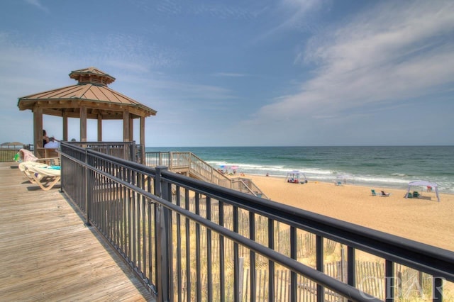 exterior space with a gazebo and a beach view