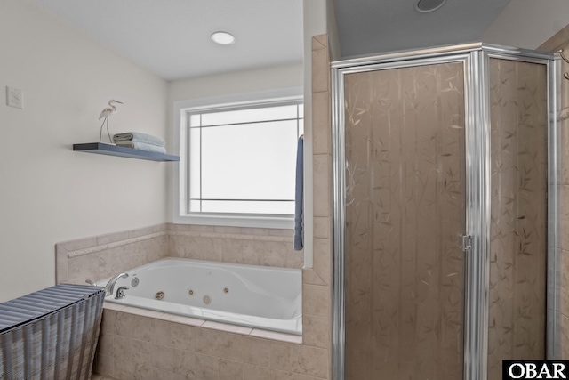 full bath featuring a shower stall and a tub with jets