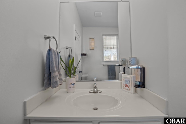 bathroom with visible vents and vanity