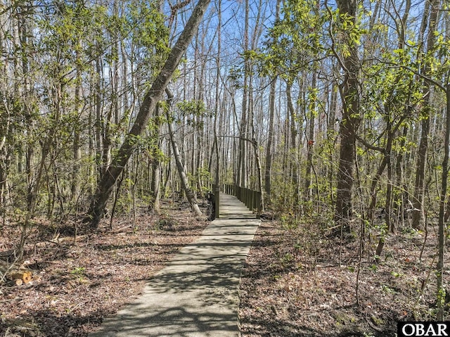 view of street featuring a wooded view