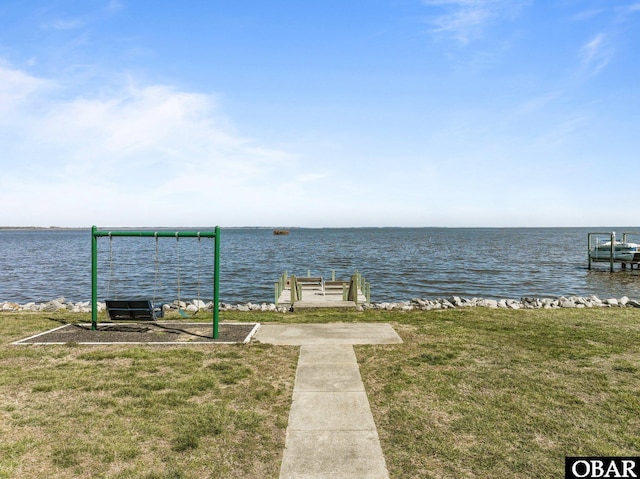 exterior space with a yard and a water view