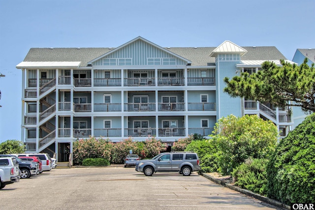 24252 Resort Rodanthe Dr Unit 1C, Rodanthe, NC 27968 - view of apartment building / complex featuring uncovered parking