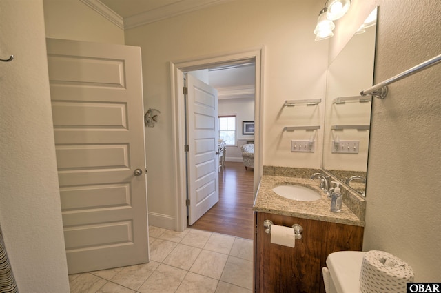 24252 Resort Rodanthe Dr Unit 1C, Rodanthe, NC 27968 - half bathroom featuring ornamental molding, vanity, tile patterned flooring, and baseboards