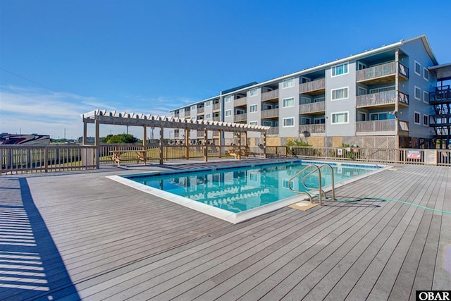 24252 Resort Rodanthe Dr Unit 1C, Rodanthe, NC 27968 - community pool with a wooden deck and a pergola