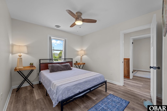 402 N Memorial Blvd Lot 3, Kill Devil Hills, NC 27948 - bedroom with light wood finished floors, baseboards, and ceiling fan