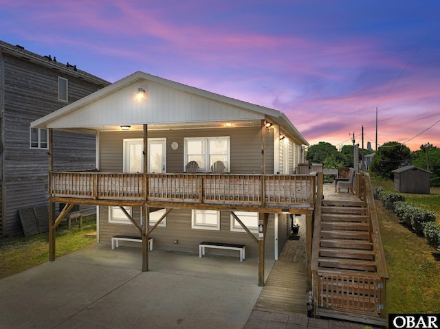 402 N Memorial Blvd Lot 3, Kill Devil Hills, NC 27948 - view of front of home featuring a deck, a patio, and stairway
