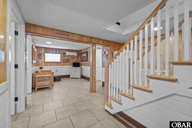 402 N Memorial Blvd Lot 3, Kill Devil Hills, NC 27948 - tiled foyer entrance featuring wood walls, a wall mounted air conditioner, and stairway
