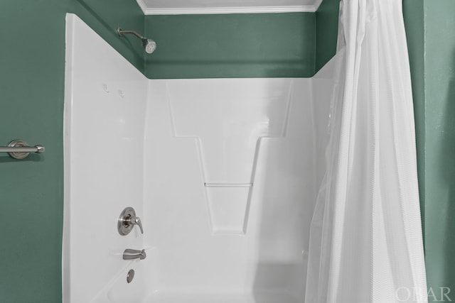 full bath featuring crown molding and shower / bathtub combination with curtain