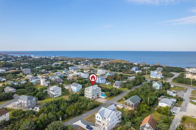 drone / aerial view with a water view and a residential view