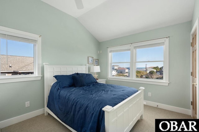 bedroom featuring vaulted ceiling, multiple windows, carpet, and baseboards