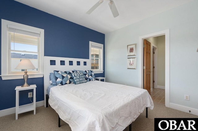 carpeted bedroom with baseboards and ceiling fan