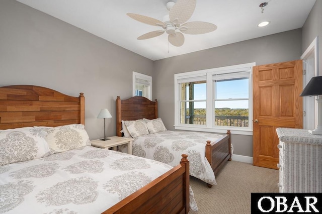 bedroom with light carpet, baseboards, and ceiling fan