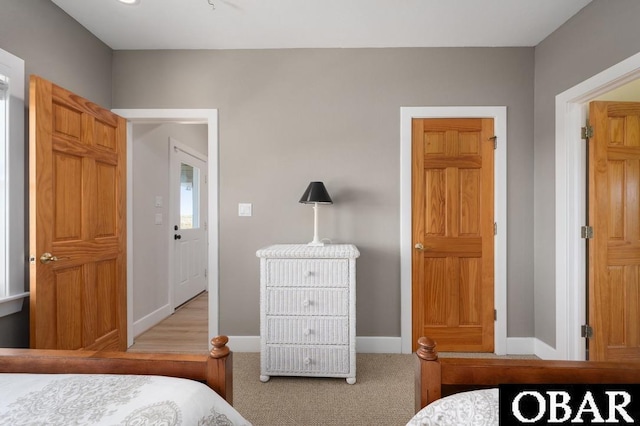 carpeted bedroom with baseboards