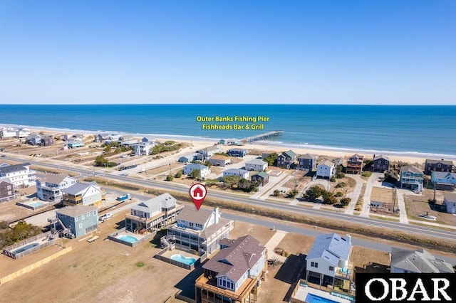 drone / aerial view with a view of the beach and a water view