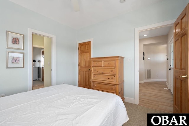 bedroom with baseboards, visible vents, carpet floors, and ceiling fan