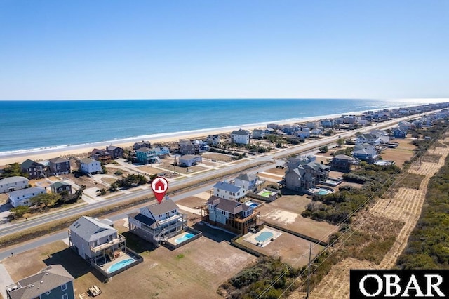 bird's eye view with a view of the beach and a water view