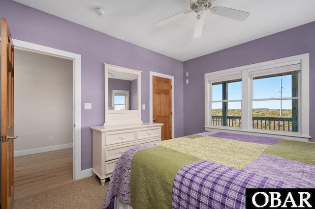 bedroom with carpet flooring, a ceiling fan, and baseboards