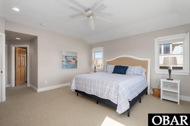 bedroom featuring lofted ceiling, a ceiling fan, baseboards, and carpet floors