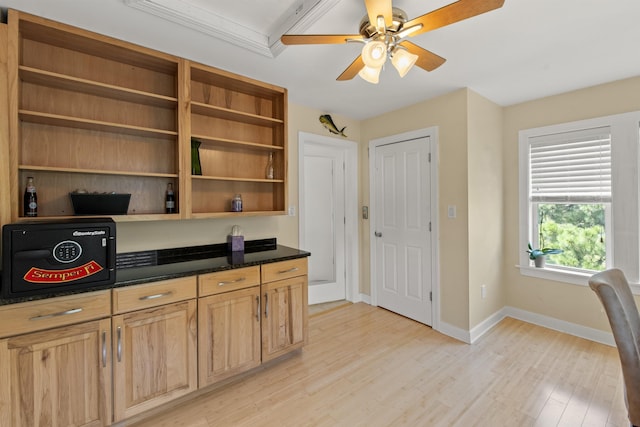 office area with a ceiling fan, baseboards, and light wood finished floors