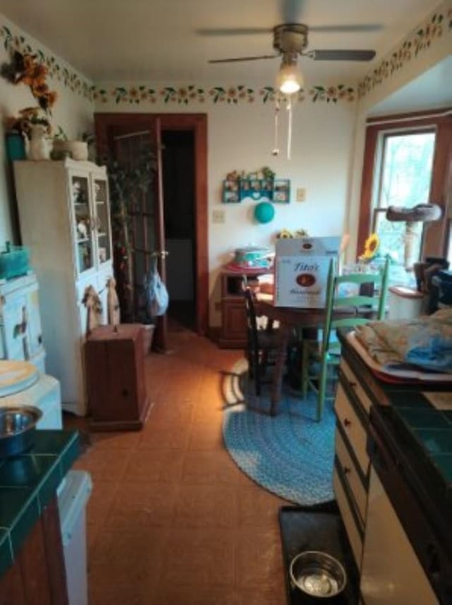 dining space with a ceiling fan