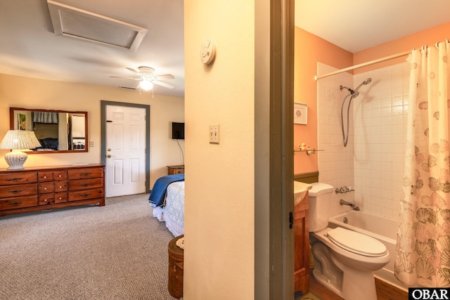 ensuite bathroom featuring toilet, shower / tub combo with curtain, and ensuite bath