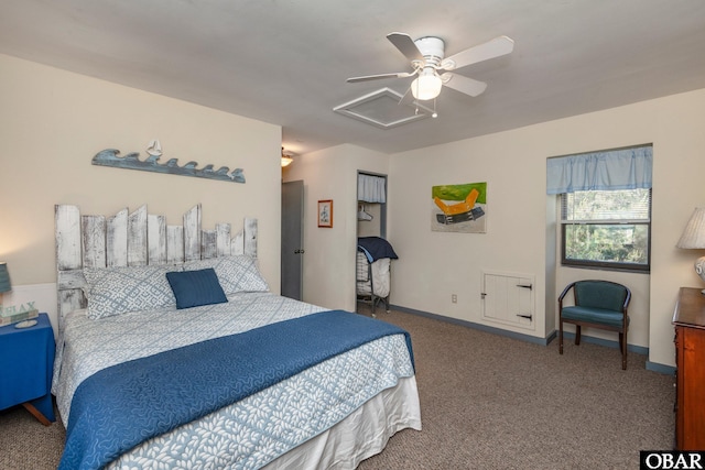 carpeted bedroom with baseboards, attic access, and a ceiling fan