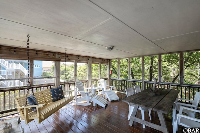 sunroom / solarium with outdoor dining space