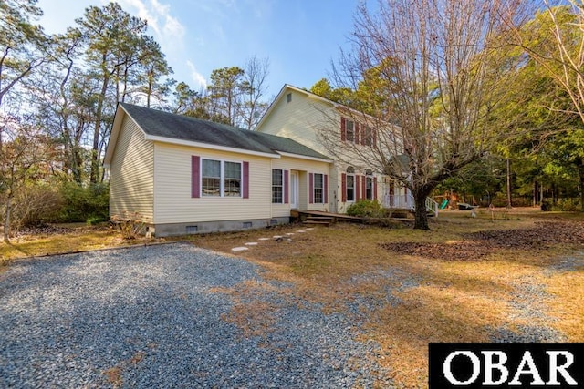 colonial-style house with crawl space and driveway