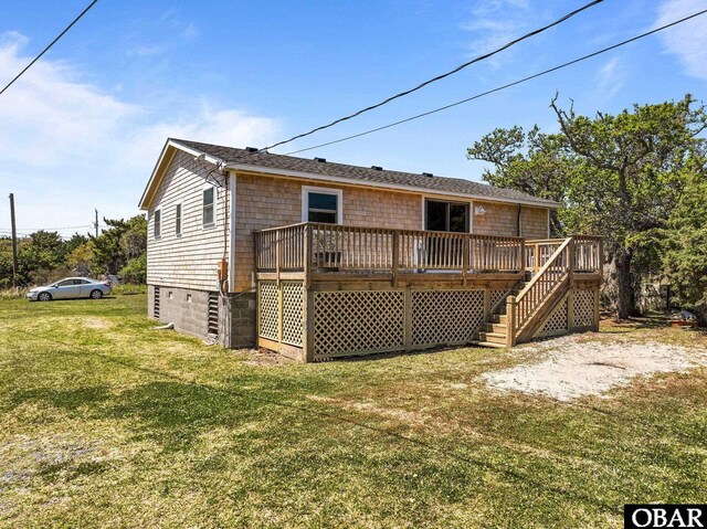 rear view of property with a wooden deck, a yard, and stairs