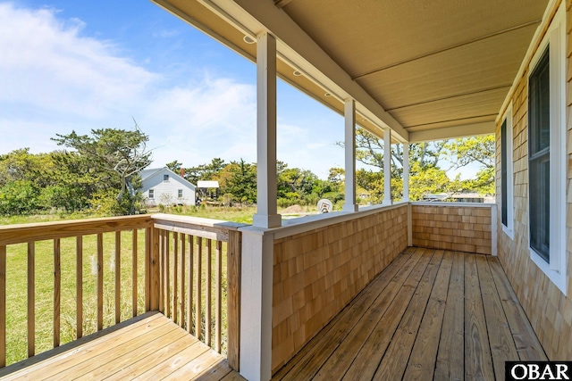 deck featuring a lawn