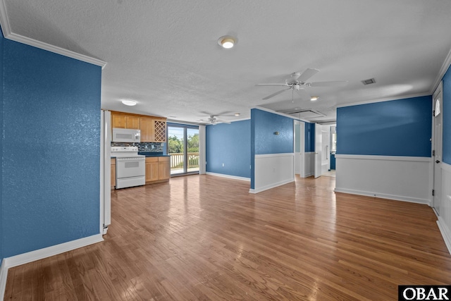 unfurnished living room with wood finished floors, a textured ceiling, ornamental molding, and ceiling fan