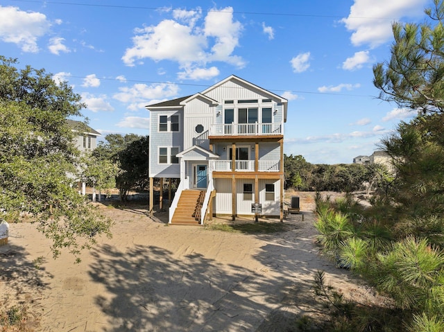 beach home featuring a balcony