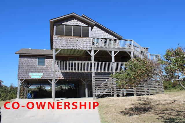 view of front facade with a carport and stairway