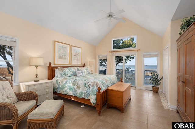 bedroom featuring access to exterior, light tile patterned flooring, high vaulted ceiling, and a ceiling fan